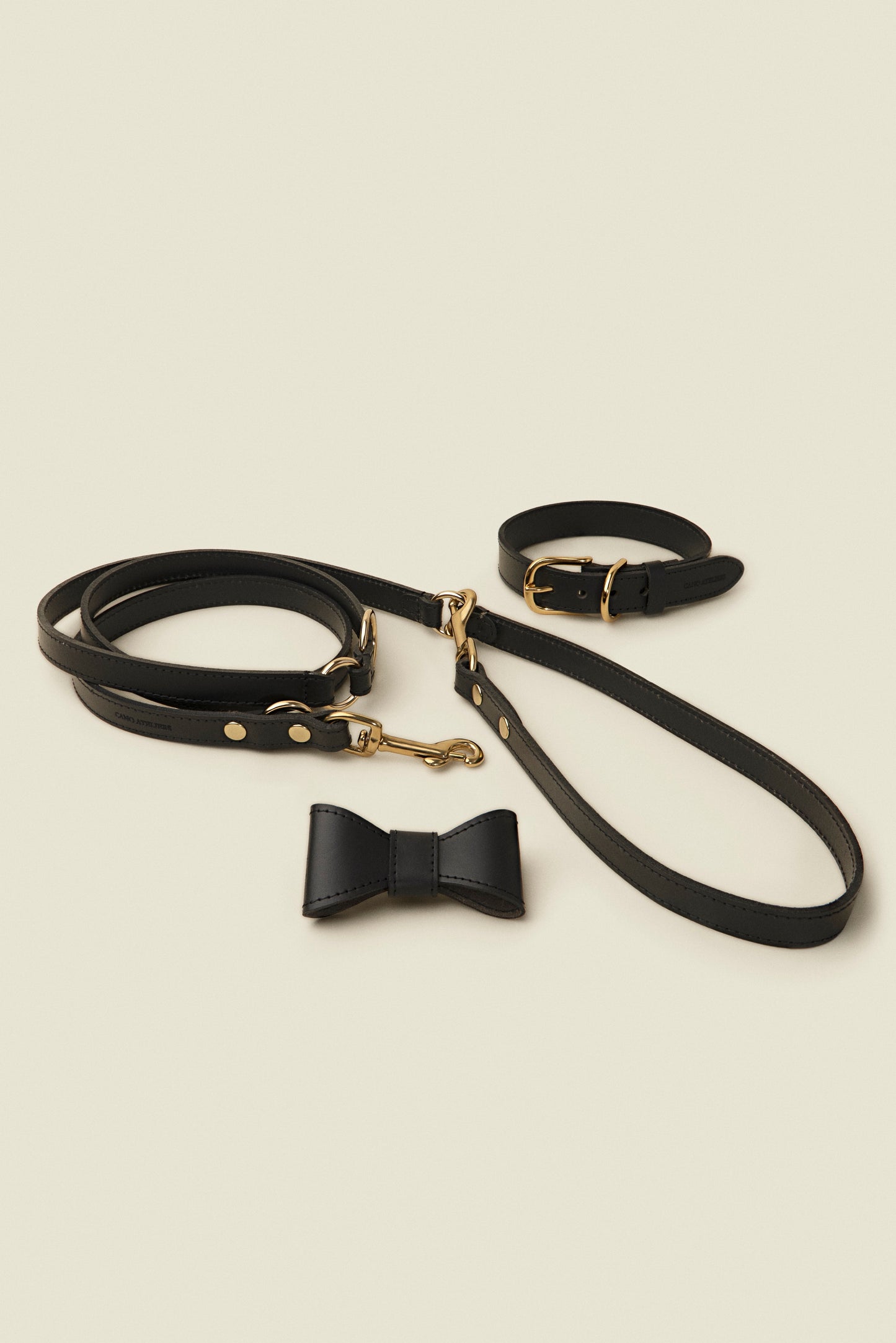 Matching black leather dog collar, leash and bowtie set by Cano Ateliers
