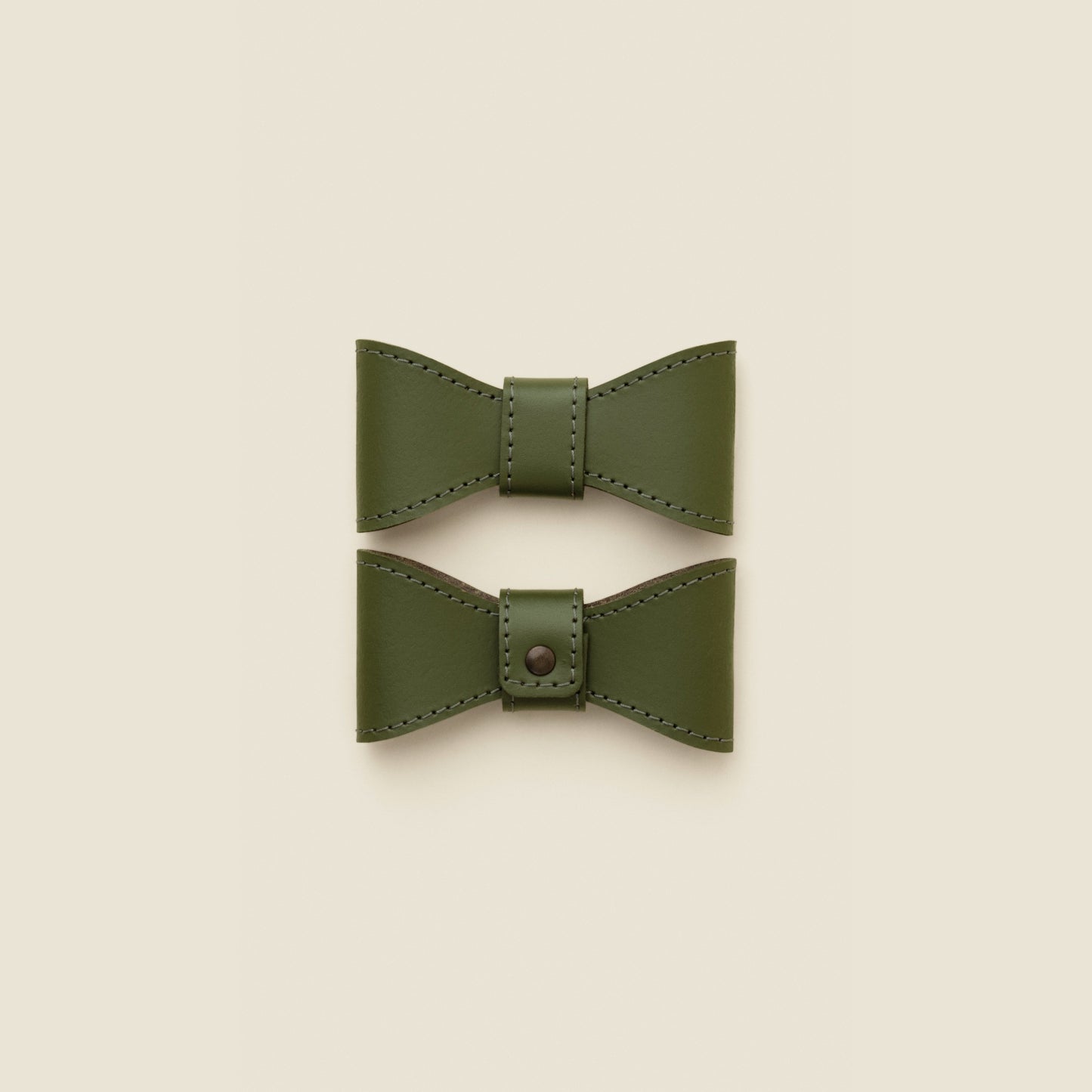 Removable green leather dog bowtie by Cano Ateliers
