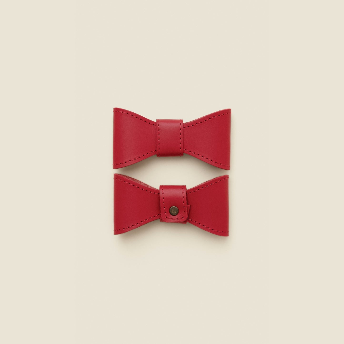Removable red leather dog bowtie by Cano Ateliers