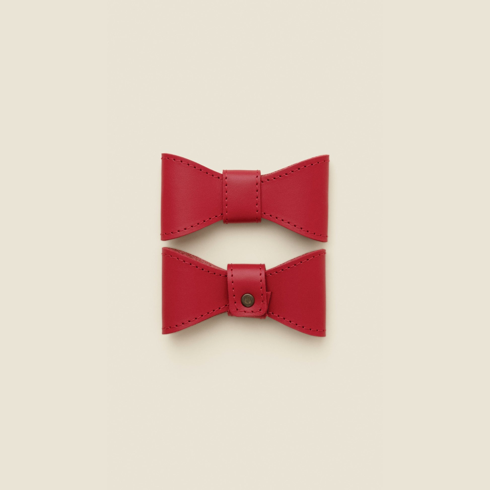 Removable red leather dog bowtie by Cano Ateliers