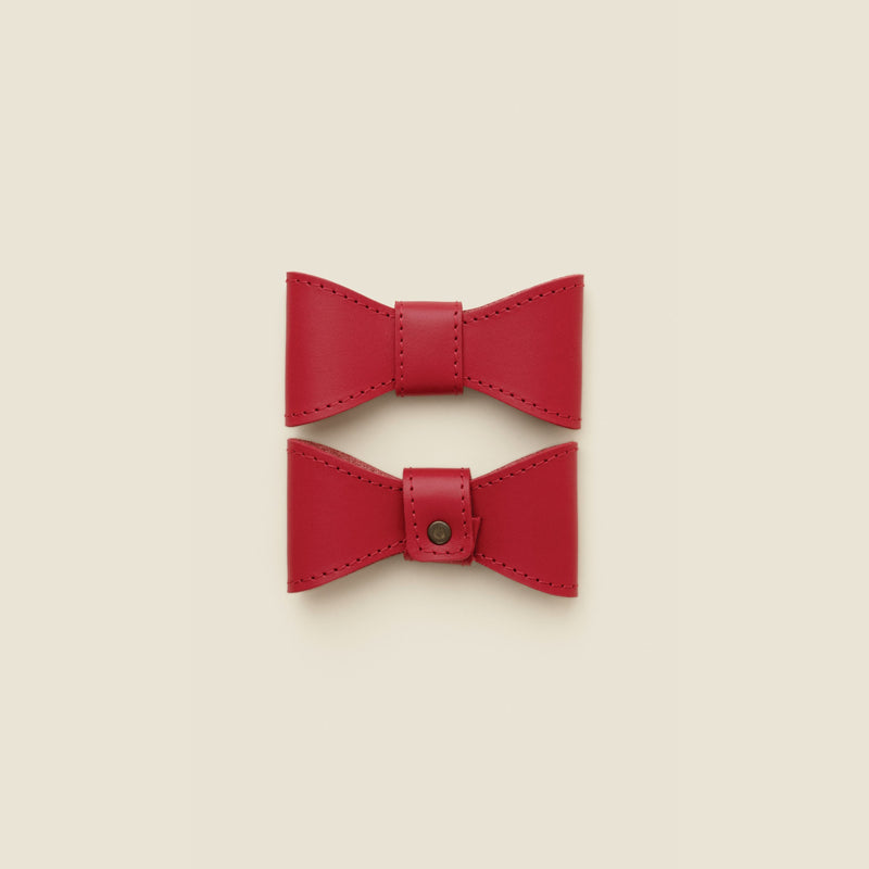 Removable red leather dog bowtie by Cano Ateliers