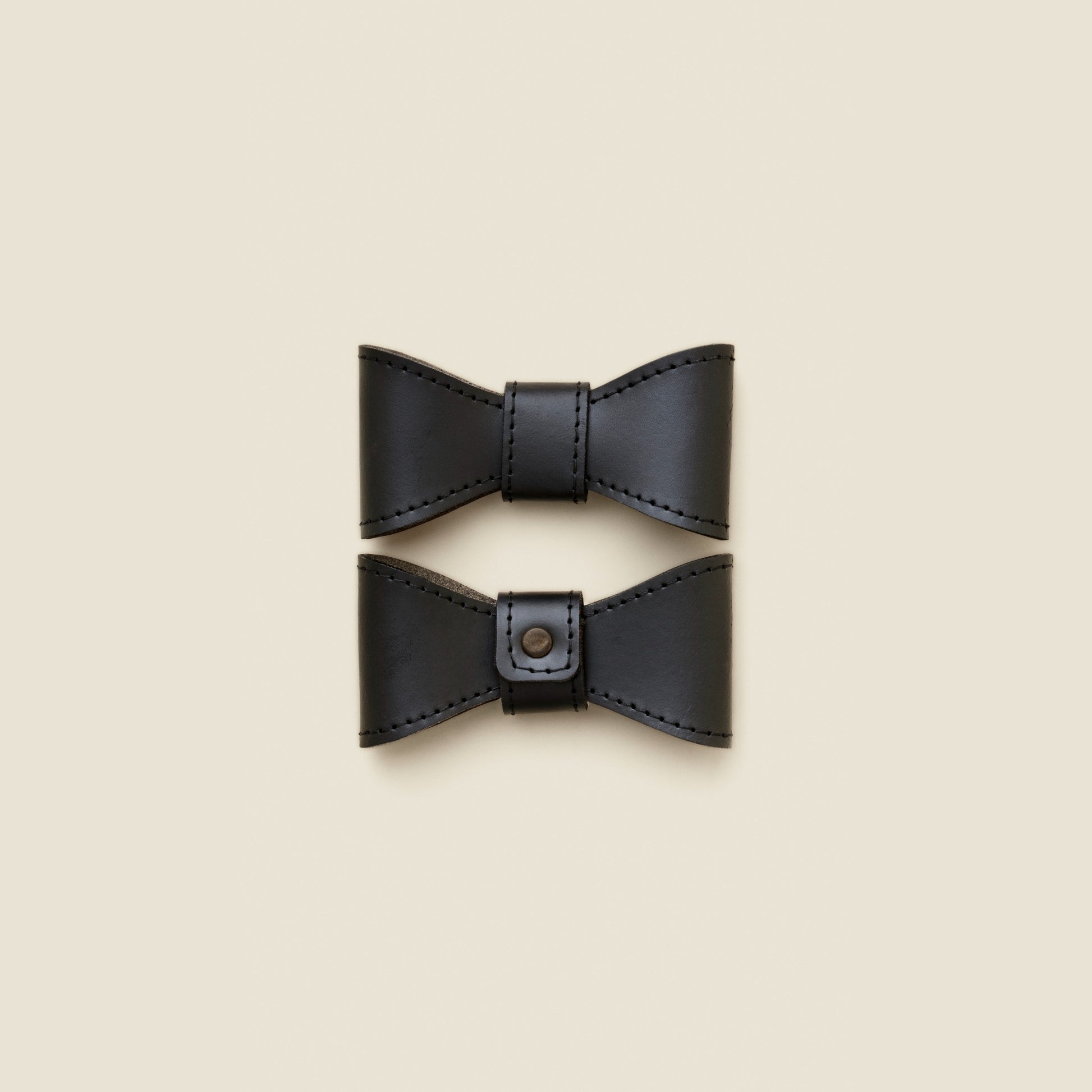 Removable black leather dog bowtie by Cano Ateliers
