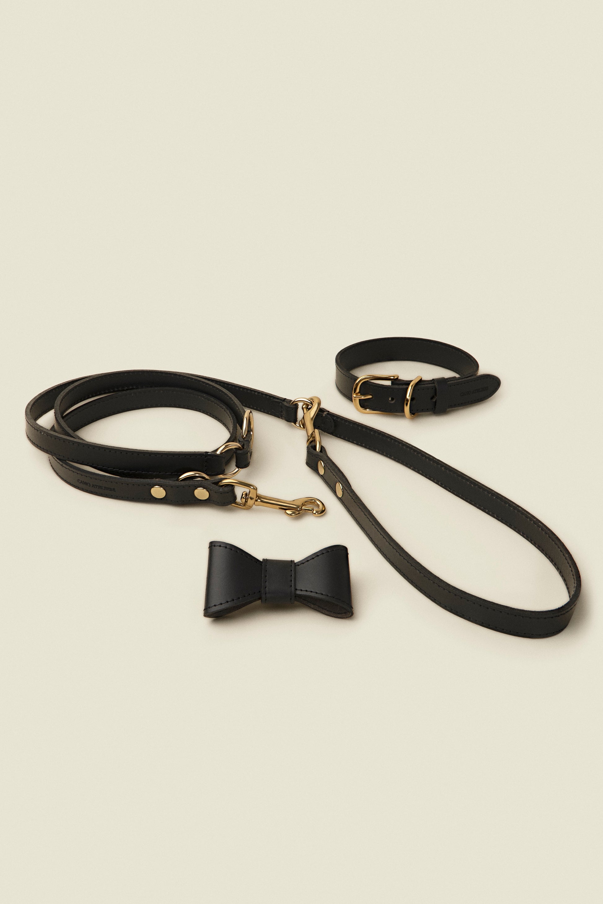Matching black leather dog collar, leash and bowtie set by Cano Ateliers