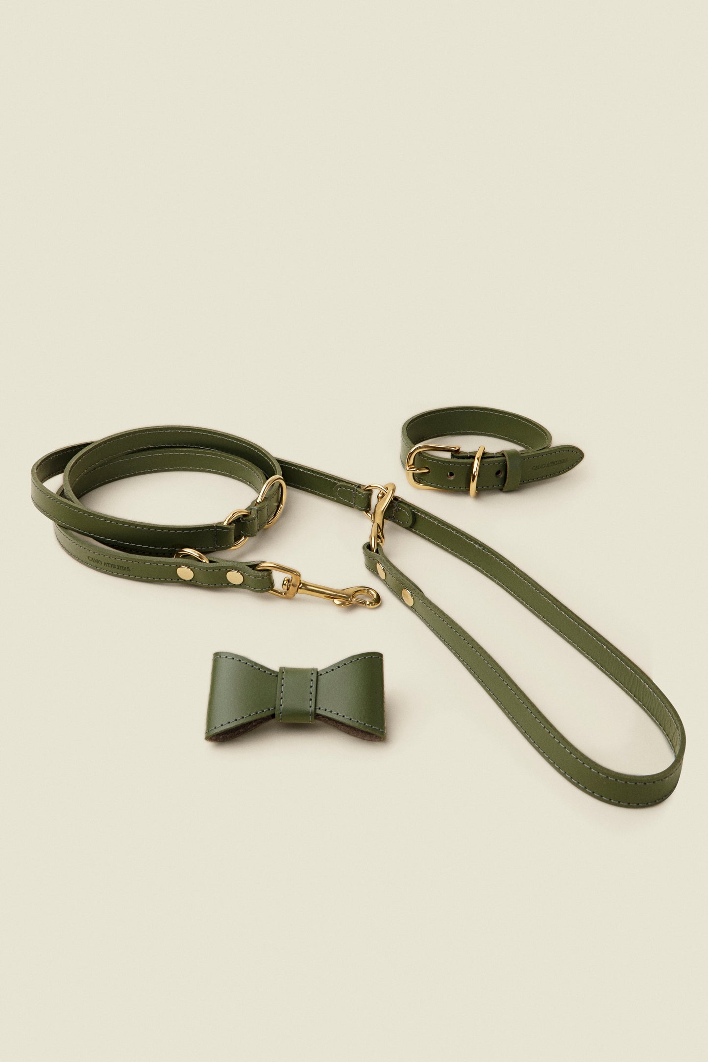 Matching green leather dog collar, leash and bowtie set by Cano Ateliers