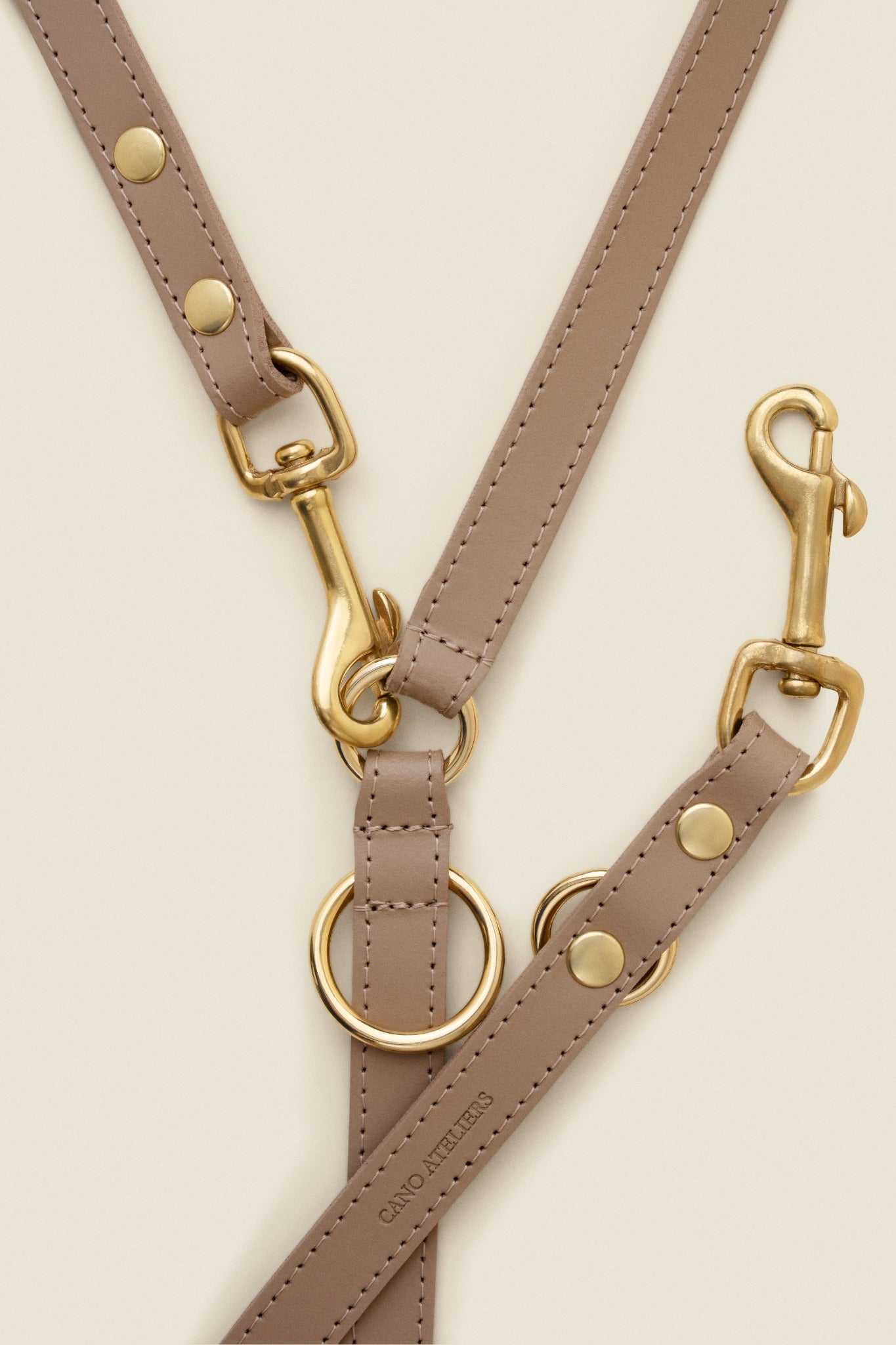 Adjustable taupe leather dog leash with gold hardware by Cano Ateliers